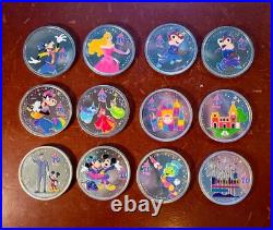 Disney Disneyland 70th & Christmas Colored Coins Set Of 12 Medallions Colorized
